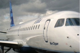 File photo: A JetBlue plane sits on the runway at Long Beach Airport.