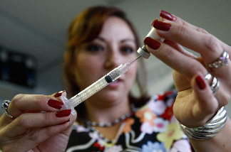Medical assistant Elissa Ortivez draws an MMR vaccination at the Spanish Peaks Outreach Clinic on August 5, 2009 in Walsenburg, Colorado.