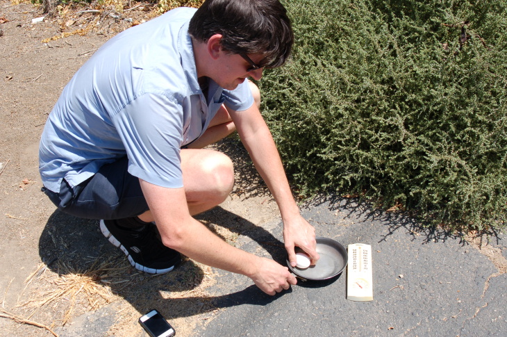 KPCC's John Rabe in Sherwood Forest preparing to fry an egg on the sidewalk.