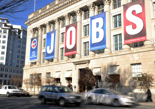 A jobs sign hangs above the entrance to