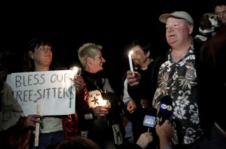 Protestor Camron Stone speaks during a candlelight vigil on Jan. 12, 2011 in support of tree-sitters who are attempting to keep oak trees from being felled in Arcadia.