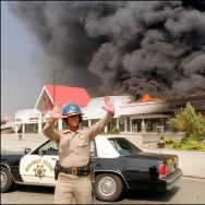 A California Highway patrolman directs r
