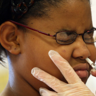 Fourth-grader Jasmine Johnson got a FluMist spray at her Annapolis, Md., elementary school in 2007. This year, the nasal spray vaccine isn't recommended.