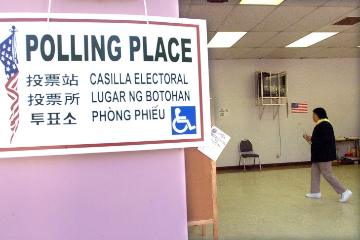 A poster designating a polling station at a school