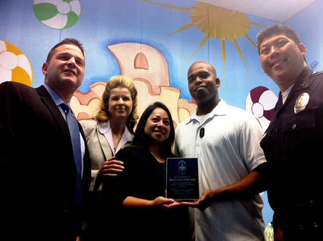 LAPD Lt. Marc Reina, Capt. Beatrice Girmala, Xiomara Padilla-Banks, Darnell Banks, and Capt. Duane Hayakawa in the Miguel Leonard Padilla-Banks soft room at the Hollywood LAPD station.