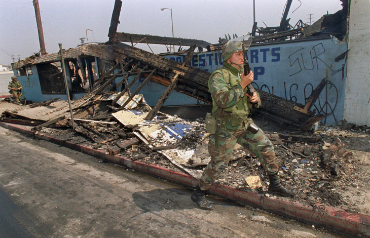National Guardsmen patrols trough a dest