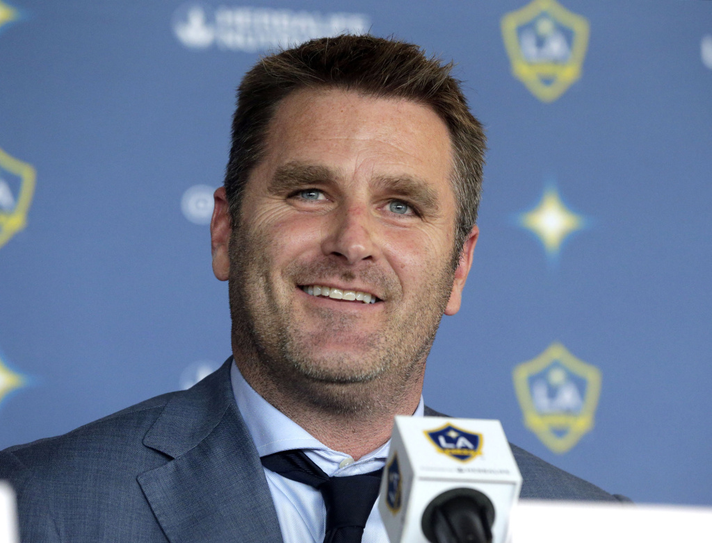Curt Onalfo smiles as he is introduced as the new head coach of the Los Angeles Galaxy soccer team at news conference in Carson, Calif., Tuesday, Dec. 13, 2016. Onalfo replaces Bruce Arena, who returned to the U.S. national team after guiding the Los Angeles Galaxy to three MLS Cup titles.