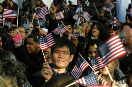 New citizens wave US flags