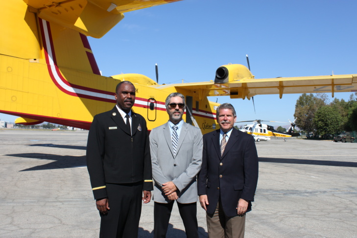 LA County Fire Chief Daryl Osby, Quebec delegue Alain Houde, and LA County Supervisor Zev Yaroslavsky in front of one of the Super Scoopers the county leases from Quebec for fire season. Van Nuys Airport, 9-4-2012.
