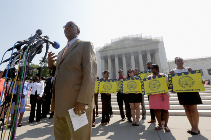 Field Director Charles White of the National Association for the Advancement of Colored People (NAACP) speaks at a podium outside the U.S. Supreme Court on Tuesday in Washington, D.C.