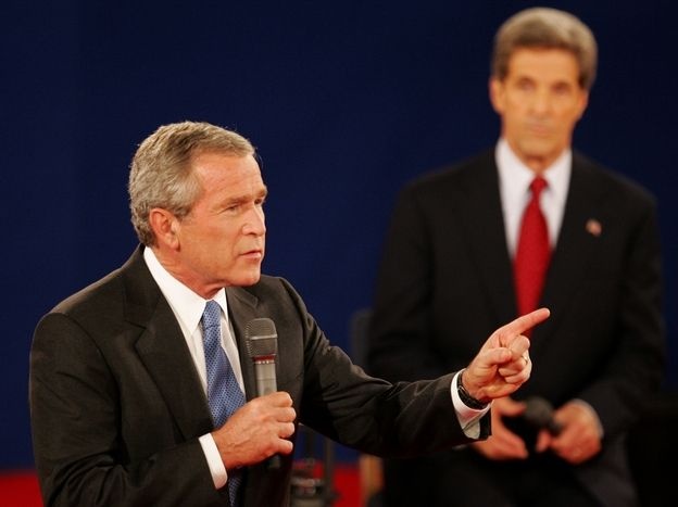 In a 2004 debate in St. Louis, President Bush answers a question as his opponent, Sen. John Kerry, listens. Both candidates used a number of "pivots" in their debates.