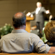 Worshippers listen to a sermon during a