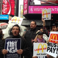 Workers and labor organizers in New York City protest the alleged exploitation of students on J-1 summer work travel visas who worked at a Pennsylvania McDonald's, on Thursday.