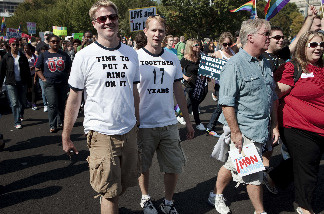 Activists march during a protest October 11, 2009 in Washington, DC. Activists gathered in DC to push President Barack Obama's administration and the U.S. Congress to live up to promises to the lesbian, gay, bisexual and transgender community to advance civil rights.