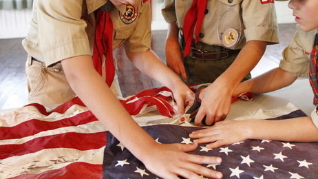 Scouts participate in a flag retirement ceremony. People involved with the Boy Scouting movement face the court-ordered release of the organization's "perversion files" with mixed emotions.