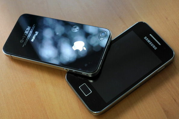 A Samsung phone (right) and Apple's iPhone 4. Some U.S. phone designers are now conflicted over what a recent decision that Samsung infringed on Apple mobile phone patents will mean for their work.