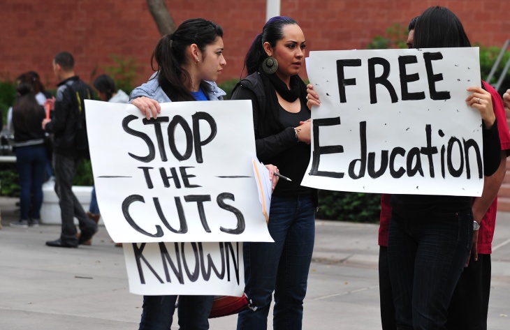 Students holding placards try to attract