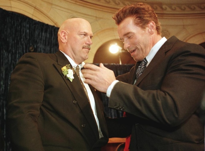 Former pro wrestling bad guy Jesse Ventura (L) is