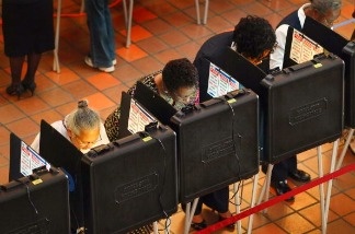 Voters in Miami-Dade County cast ballots in the 2010 midterm election. The changing politics of the large, multiracial Latino voting population there and throughout Florida could turn it into one of the swingiest states this presidential election.