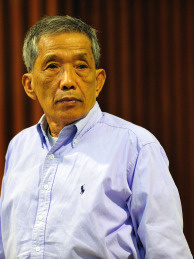 In this handout released by Extraordinary Chamber in the Courts of Cambodia (ECCC), Kaing Guek Eav, also known as 'Duch' stands in the courtroomin Phnom Penh province. The UN -backed Khmer Rouge tribunal convicted the former prison chief to 35 years for overseeing the torture and execution of more than 15,000 people at the notorious S-21 prison known as Tuol Sleng. Kaing Guek Eay, 67, will serve only 19 years of the sentence since he already spent 11 years awaiting the trial in detention.