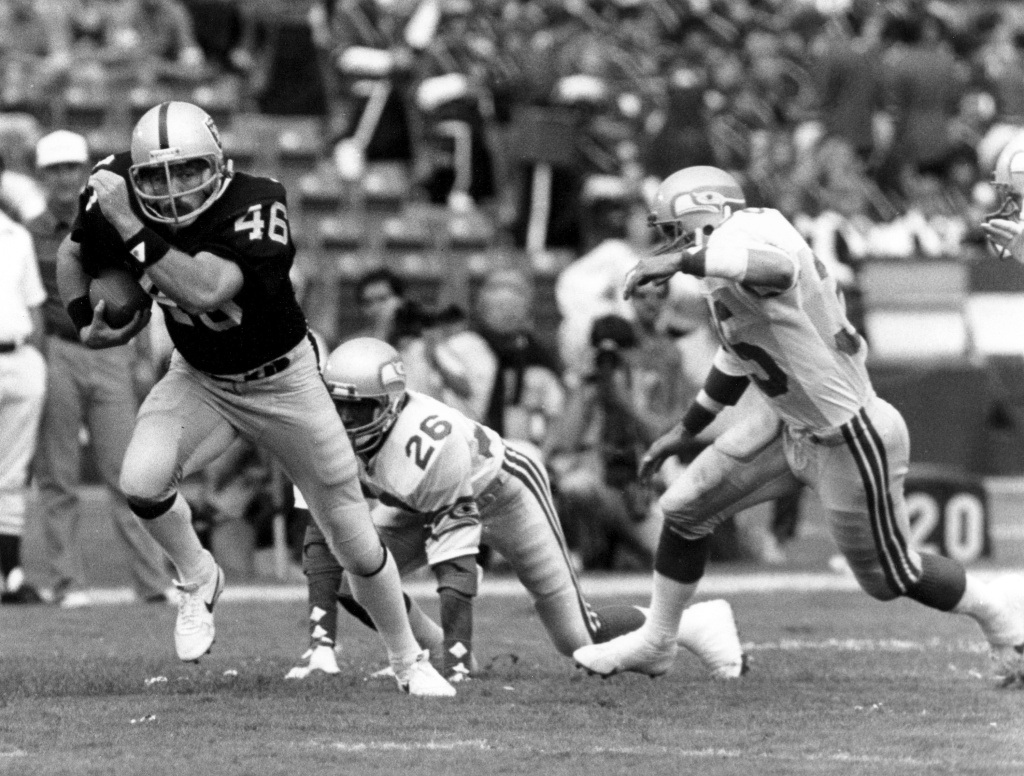 In this Oct. 30, 1983 photo provided by the NFL, Los Angeles Raiders tight end Todd Christensen (46) runs with the football after making a catch during a football game against the Seattle Seahawks in Los Angeles. Former Raiders tight end and five-time Pro Bowler Todd Christensen died from complications during liver transplant surgery. He was 57. Christensen's son, Toby Christensen, said his father passed away Wednesday morning, Nov. 13, 2013, at Intermountain Medical Center near his home in Alpine, Utah.