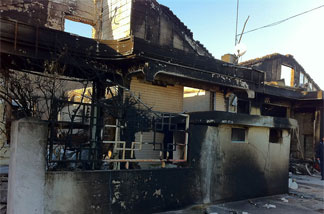 Charred remains of houses on Yeonpyeong, two days after the island was subjected to a barrage of 170 artillery shells, fired by the North Korean army.