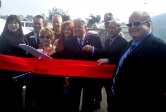 L.A. County Supervisor Don Knabe, with scissors, joins Caltrans officials for the ribbon cutting ceremony marking the opening of the westbound Pomona (60) Freeway HOV lane.
