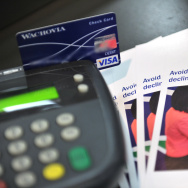 A photo illustration shows a debit card