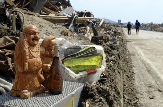 Salvaged sculptures are placed beside a road in Rikuzentakata, Iwate prefecture on March 29, 2011. The earthquake and tsunami that struck Japan caused at least $200 billion in damage, estimate officials.