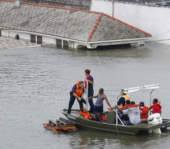Emergency personnel rescue residents fro