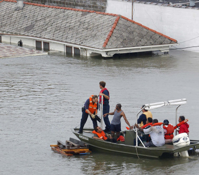 Emergency personnel rescue residents fro