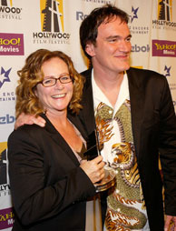 Editor Sally Menke with her Editing award poses with director Quentin Tarantino backstage at The Hollywood Awards Gala at the Beverly Hilton Hotel October 18, 2004 in Beverly Hills, California.