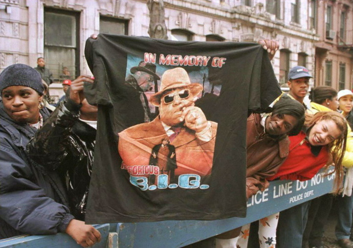 A man displays a T-shirt tribute to rapper Biggie