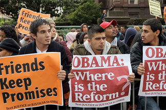 Protesters demanding immigration reform greet President Obama during an earlier visit to San Francisco. It's looking like a reform agreement won't be reached this year, as the year draws to a close with no consensus reached in Congress.