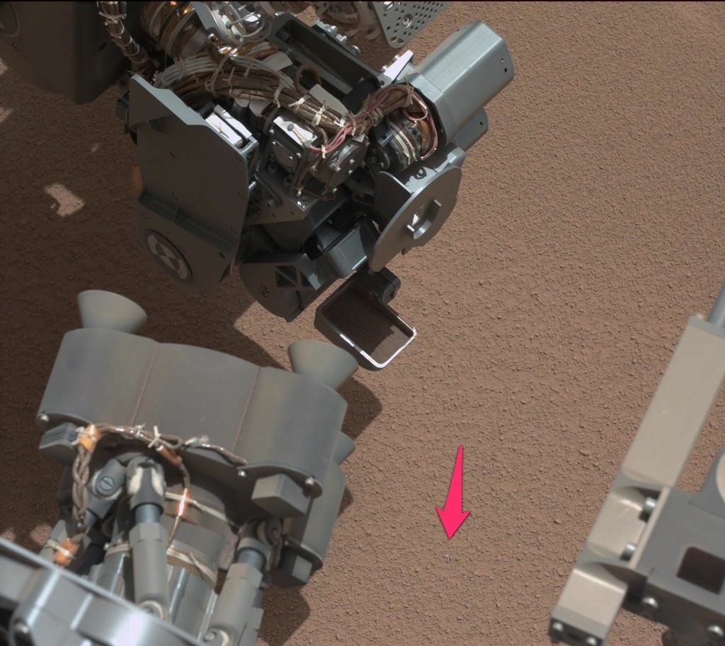 This shiny object on Mars (emphasis added by KPCC) is likely a piece of the Curiosity rover that came loose during entry, descent or landing, according to NASA.
