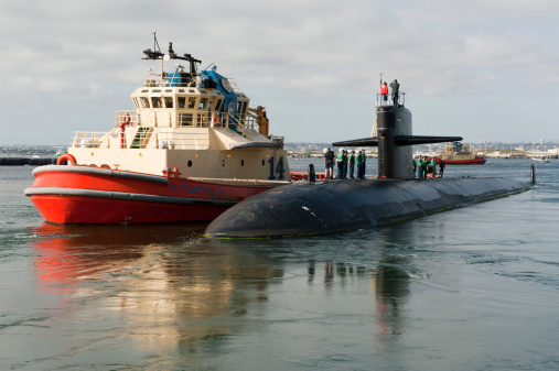 The Los Angeles-class attack submarine USS San Francisco (SSN 711) returns to Naval Base Point Loma from a daylong distinguished visitor embarkation. Navy officials are investigating a report of an armed man at Naval Base Point Loma.