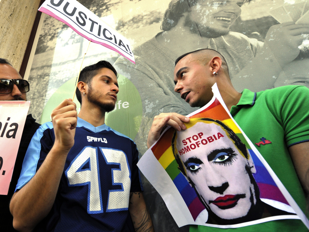 Demonstrators protest against homophobia and repression of gays in Russia, in front of the Russian Embassy in Madrid on August 23, 2013.