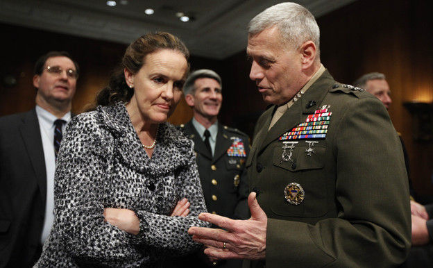 Defense Undersecretary for Policy Michele Flournoy talks with Marines Lt. Gen. John Paxton on Capitol Hill in 2010. Flournoy has since left her position to spend more time with her three children.