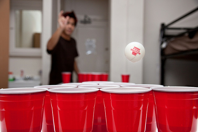 A game of beer pong, a drinking game. Bud Light was shown to be the alcohol of choice among underage drinkers in a recent survey.