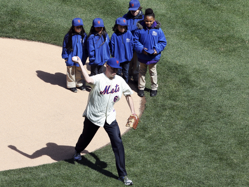 New York Mayor Bill de Blasio throws the ceremonial first pitch Tuesday. Even though he was flanked by children, the Mets home crowd booed de Blasio — an unabashed Red Sox fan.