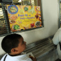 A cafeteria worker supervises lunches fo