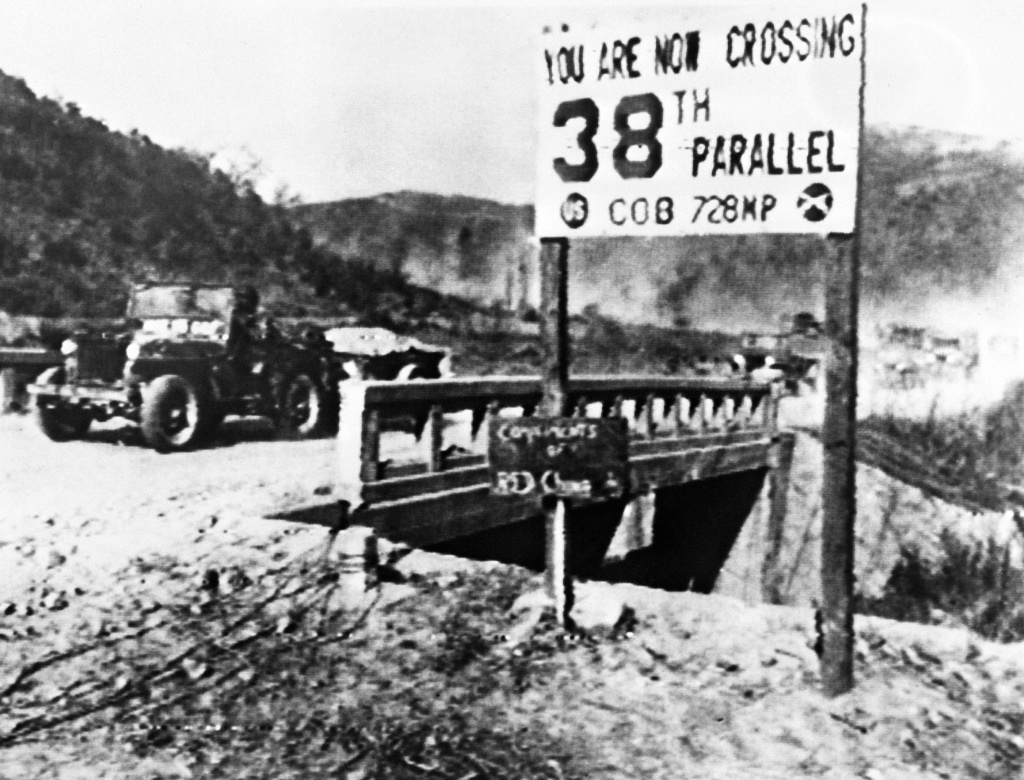 File: A jeep of the United Nations forces withdrawing from Pyongyang, the North Korean capital, recrosses the 38th parallel in December 1950. The Korean War between armies from North Korea and from South Korea lasted from June 25, 1950 to July 27, 1953.
