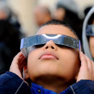 Children wear special glasses as they wa