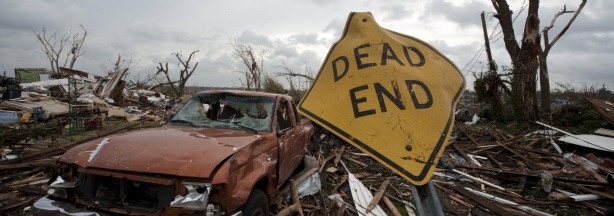 A storm-damaged sign stands in a neighborhood after a massive tornado passed through the town killing more than 120 people on May 25, 2011 in Joplin, Missouri.