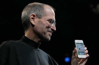 Apple CEO Steve Jobs holds the new iPhone 4 after he delivered the opening keynote address at the 2010 Apple World Wide Developers conference June 7, 2010 in San Francisco, California.