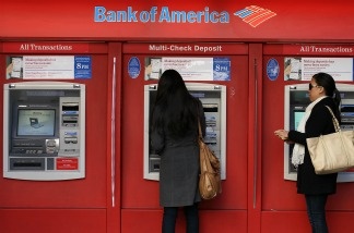 Bank of America customers use an ATM on January 21, 2011 in San Francisco, California. Bank of America reported today that it has reached an agreement for an $8.5 billion settlement with a group of investors who lost money buying mortgage-backed securities from Countrywide Financial.