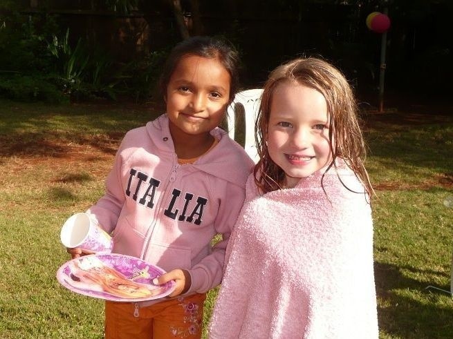 The author's daughter, right, with her friend Banita. The two girls lived next door to each other in Nairobi.
