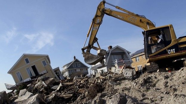 Cleanup continues on the site of a demolished home on the Rockaway Peninsula in New York on Nov. 29.