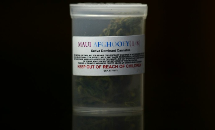 A one-eighth ounce container of Maui Afg