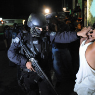 An elite police officer arrests an alleg
